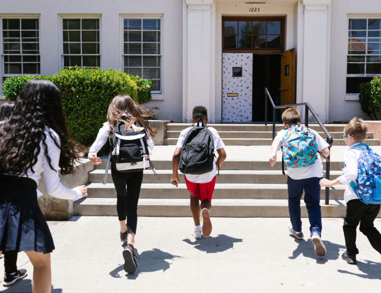 Students walking up steps to school